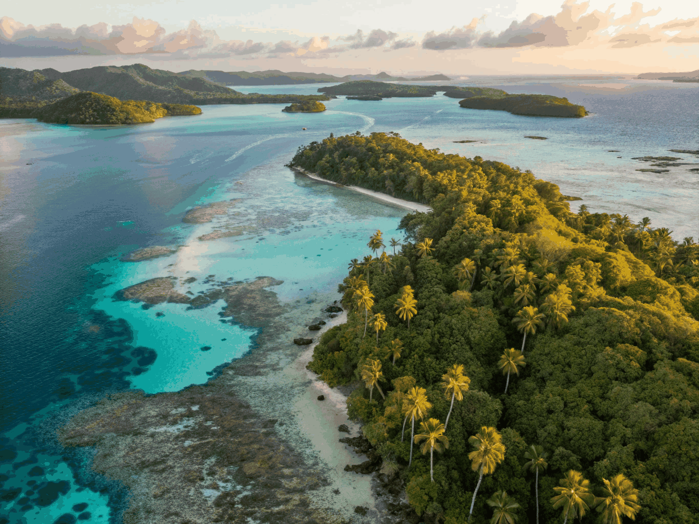 Aerial panoramic view of Rangiroa atoll reef and lagoon pass in French Polynesia